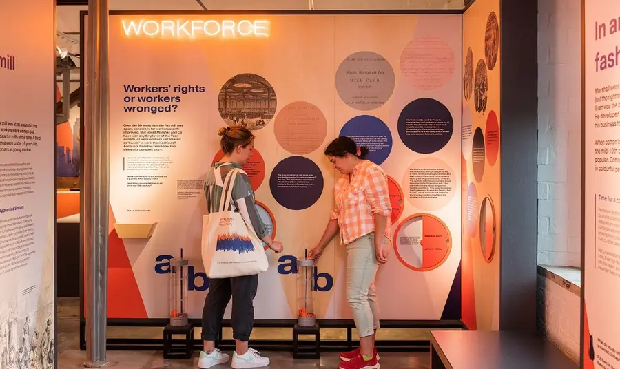 Visitors interacting with exhibits inside the new exhibition "The Mill" at Shrewsbury Flaxmill Maltings