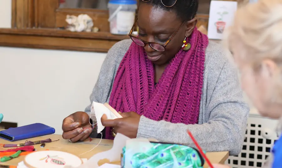 Volunteer doing sewing crafts