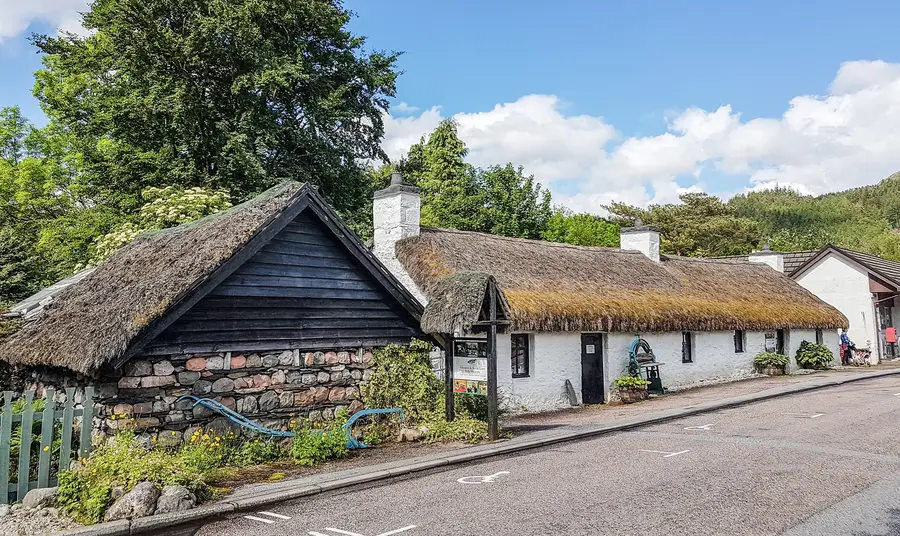 A view of a single storey centuries-old thatched house; home of the Glencoe Folk Museum.