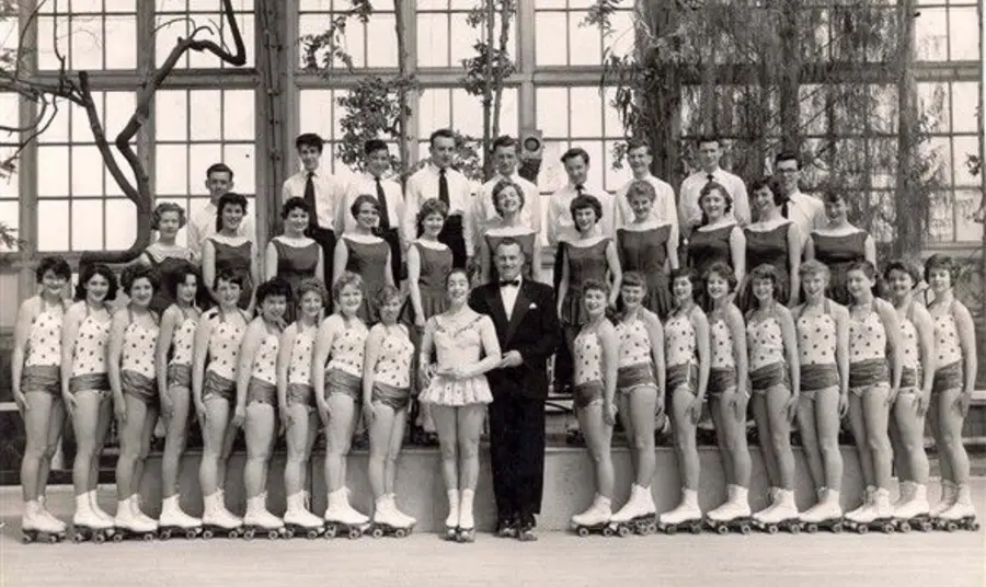 a black and white photo of a group of female rollerskaters in the Great Yarmouth Winter Gardens