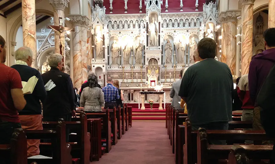 A congregation worshipping inside a church
