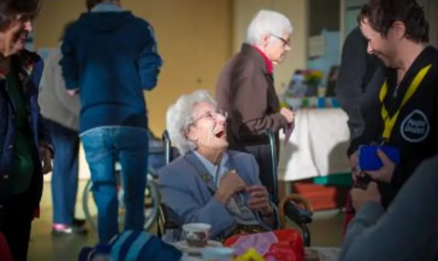 Elderly person laughing