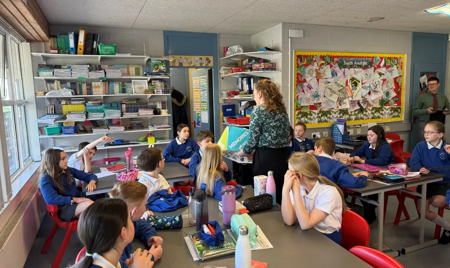 A class of school children take part in an idea development workshop.