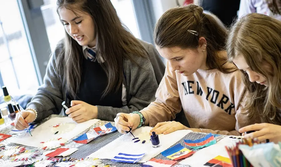 Girls create Eurovision inspired nail art at a workshop in Runcorn