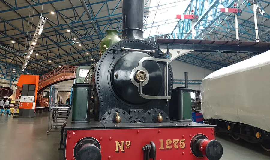A steam train in a large gallery