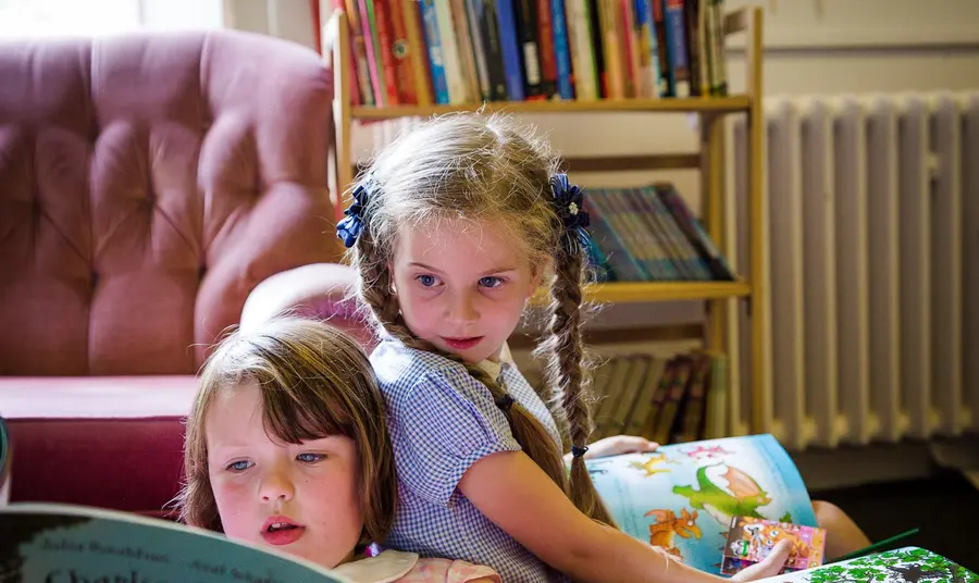 The Reader at Calderstones secures £1.99m HLF investment Two children read books as part of a Reader session