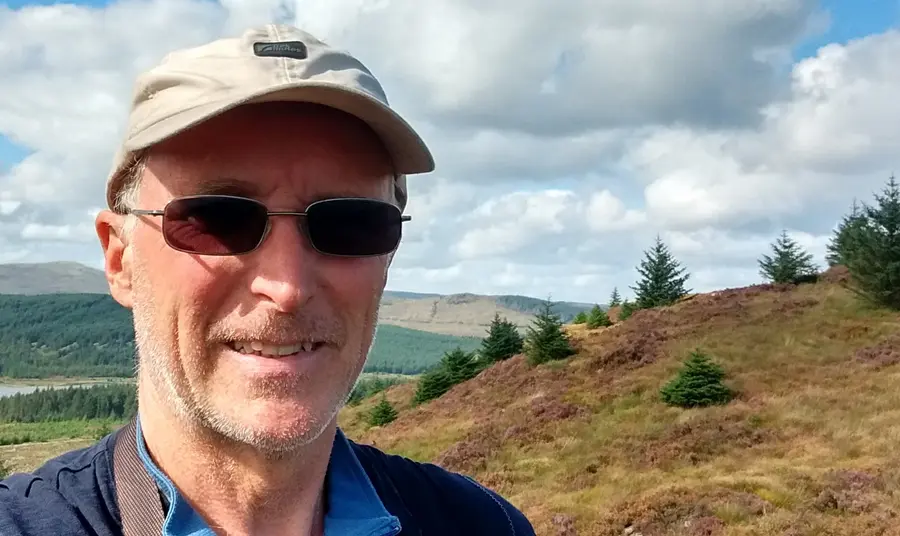 Alistair McNaught smiling in nature