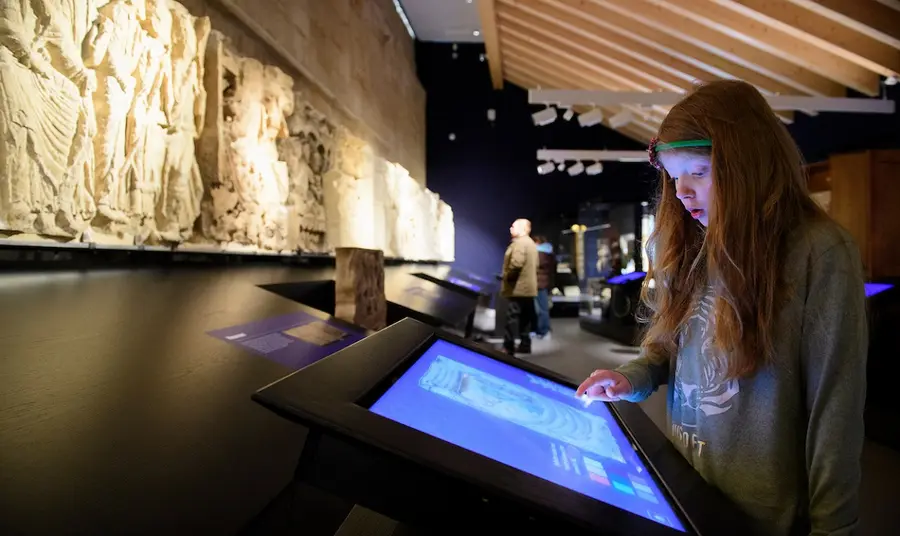 Child using a touch screen in an interactive exhibition 