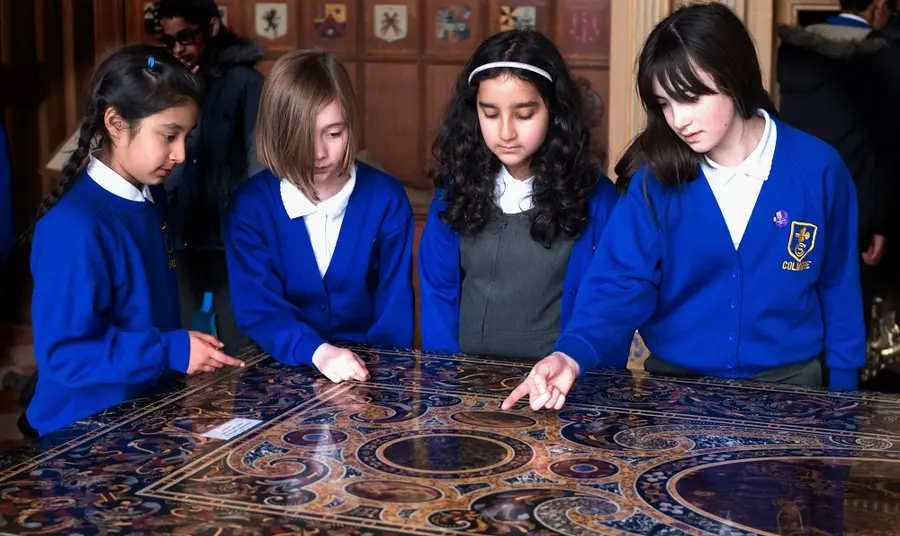 Children gathered around a table at a National Trust Property