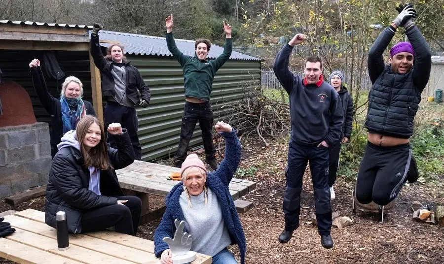 Jumping for joy at the Green Valley Conservation and Heritage Project Happy volunteers at the Green Valley Conservation and Heritage Project