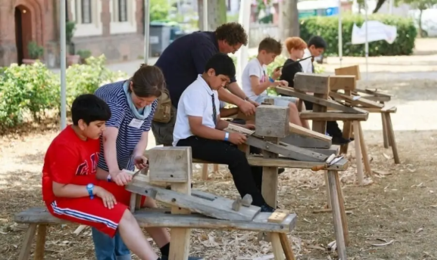 We Love Eastbury: 100 Years of Protection and Preservation Young people taking part in heritage wood working