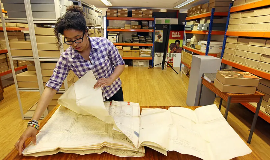 An archivist working inside the Black Cultural Archives