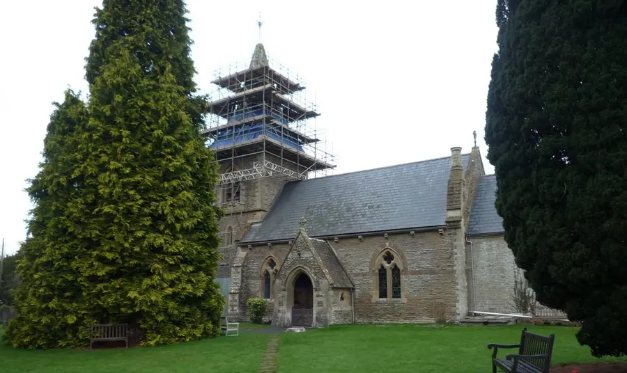 A church with scaffolding on its tower