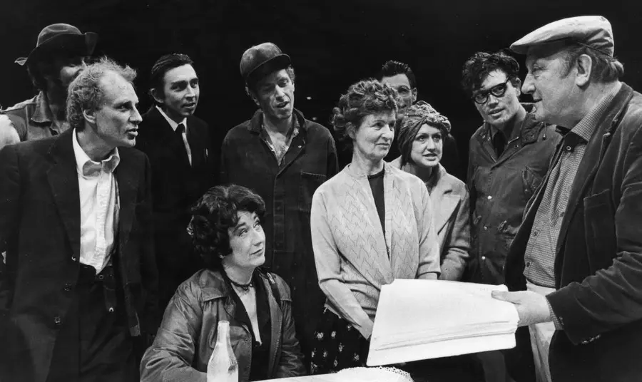 Arthur Berry and cast at the Victoria Theatre, Stoke. Arthur Berry, wearing a flat cap and holding a script, talks with the cast of one of his plays at the Victoria Theatre, Stoke.