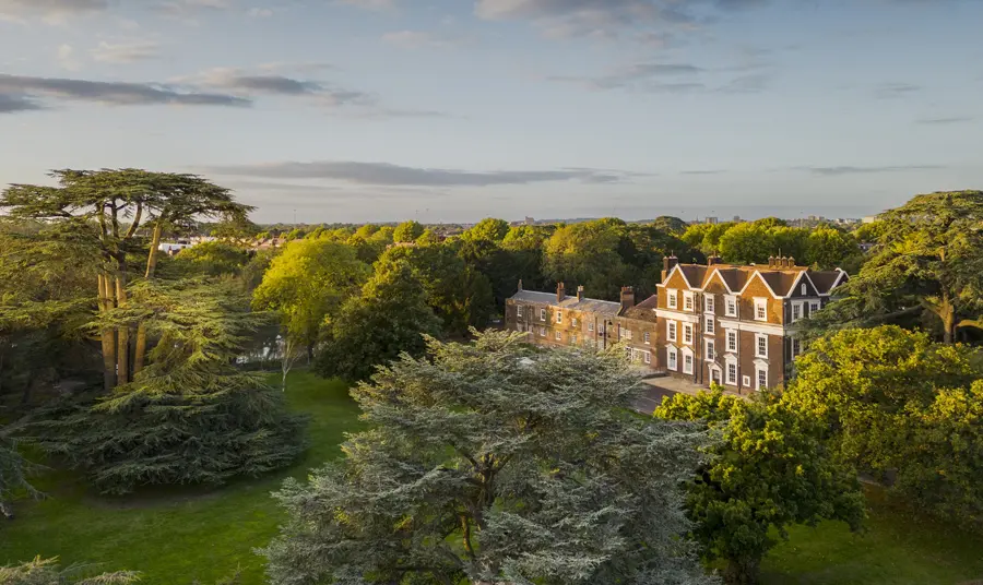 Boston Manor Park in Hounslow An ariel view of Boston Manor in its parkland with lawns and trees