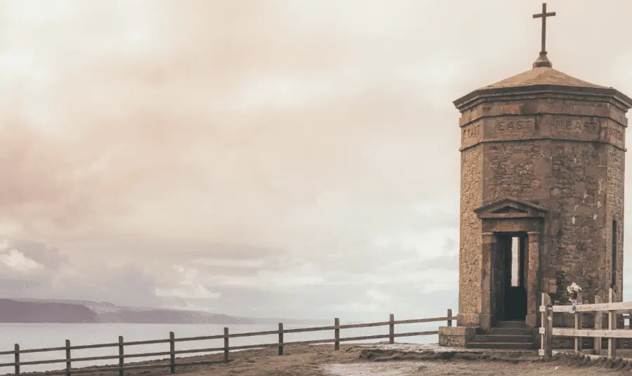 Octagonal brick structure with roof with a cross on the cliff tops above Bude in Cornwall.