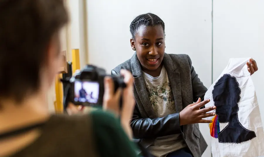 Young woman talks to camera