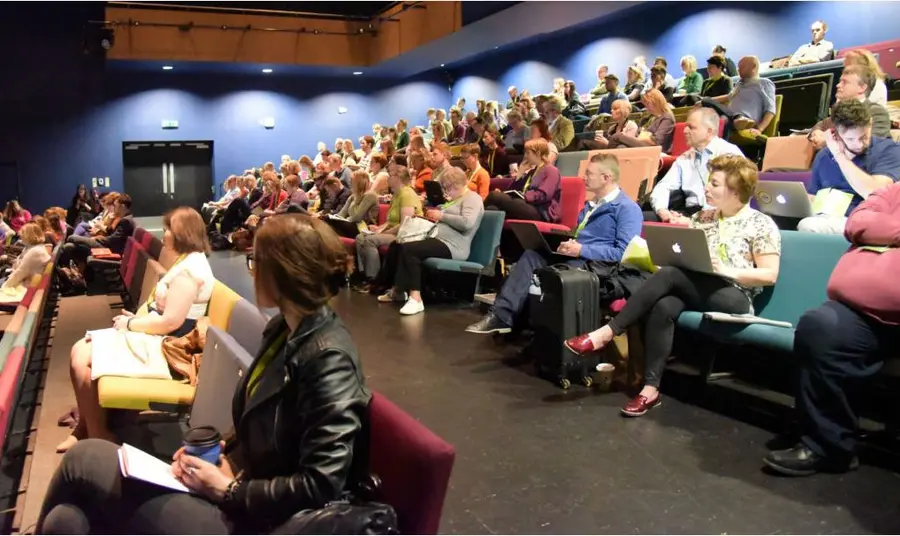 The role of heritage in uncertain times People at a conference