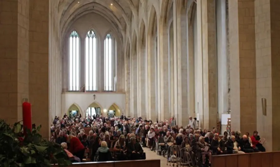 People sitting inside a church for a service