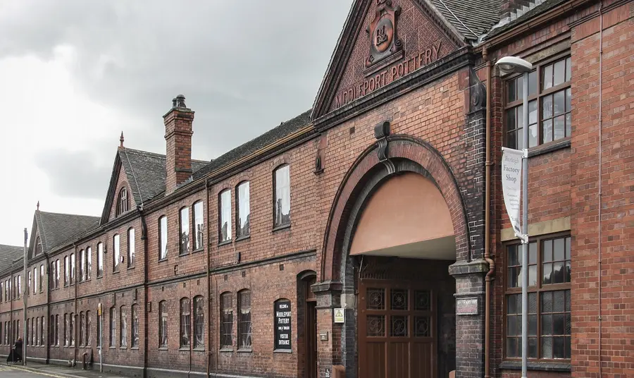 The outside front view of an old red brick building, Middleport pottery