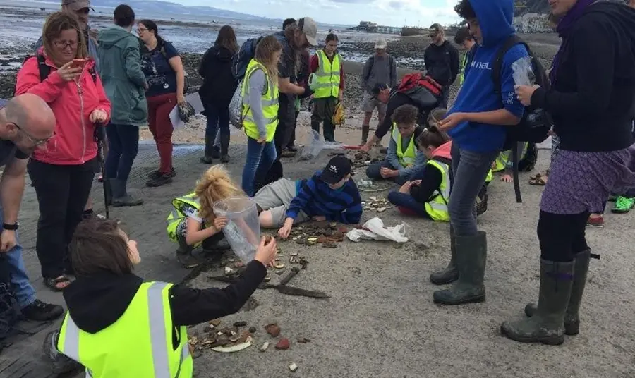 People combing the beach as part of Swansea Museum’s ‘The Lost Treasures of Swansea Bay’ project