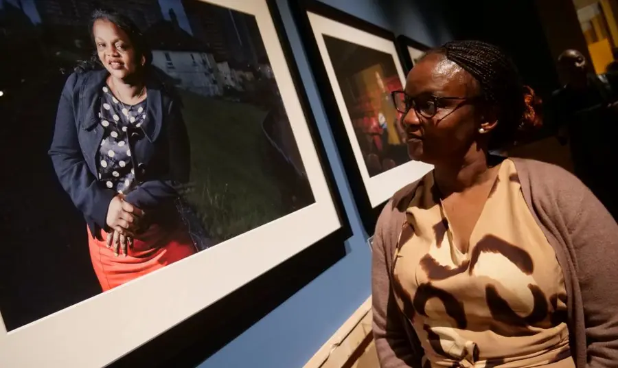 Putting Ourselves in the Picture is now open at Kelvingrove On the left is a framed photograph of a woman on the right there is a woman in a light brown dress looking at the picture