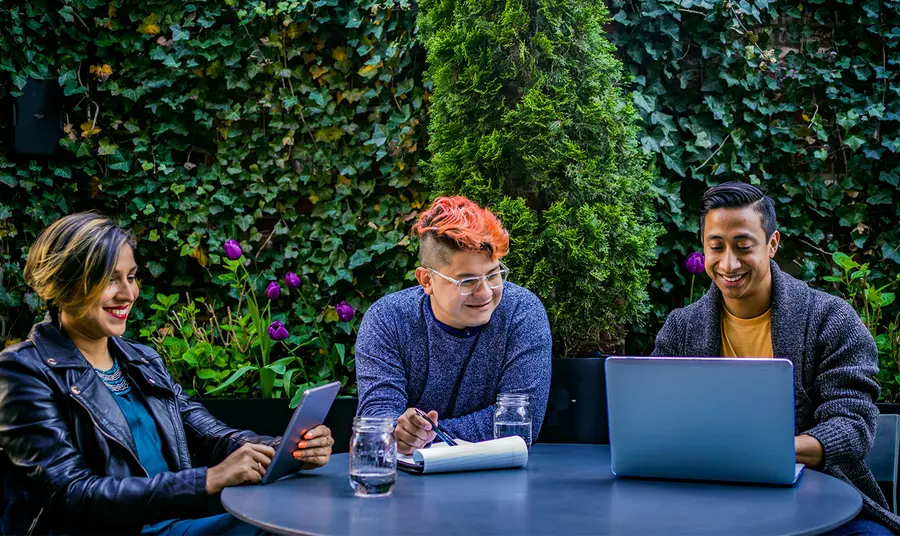 Organisations sought to deliver digital skills projects Three people using laptop and tablet