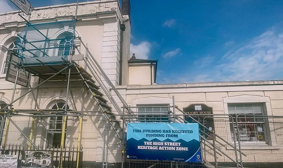 The exterior of a historic building with scaffolding on it.
