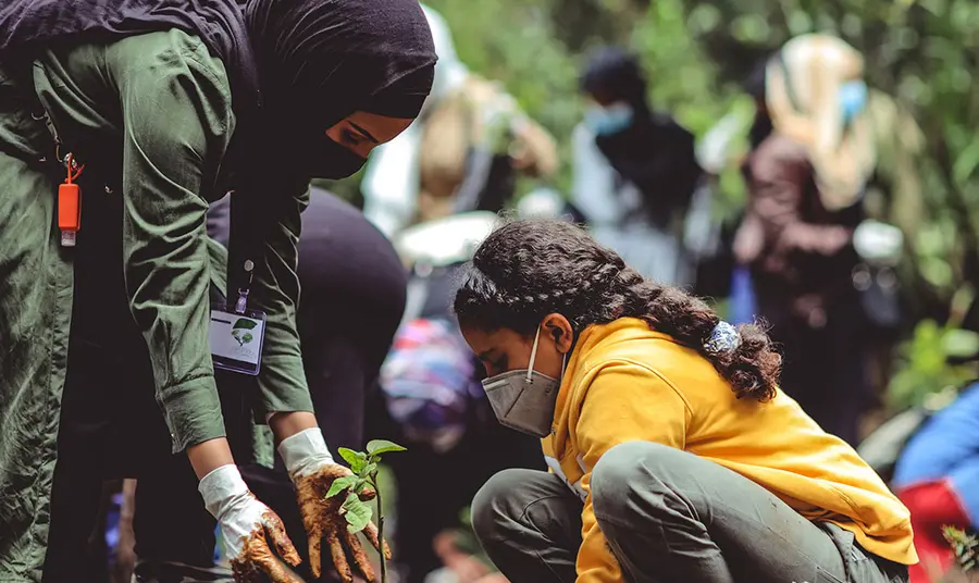 Racial equity in nature toolkit Two people planting a tree