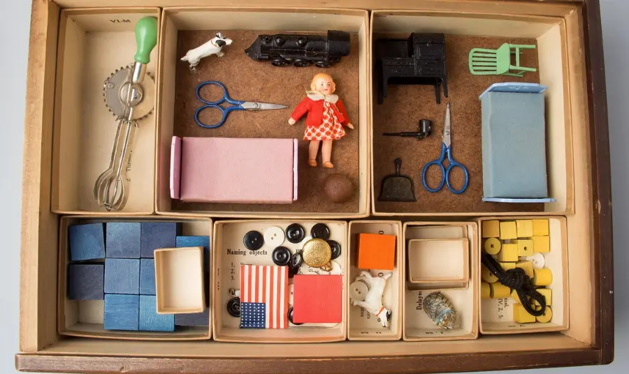 Photograph of various items in a wooden box