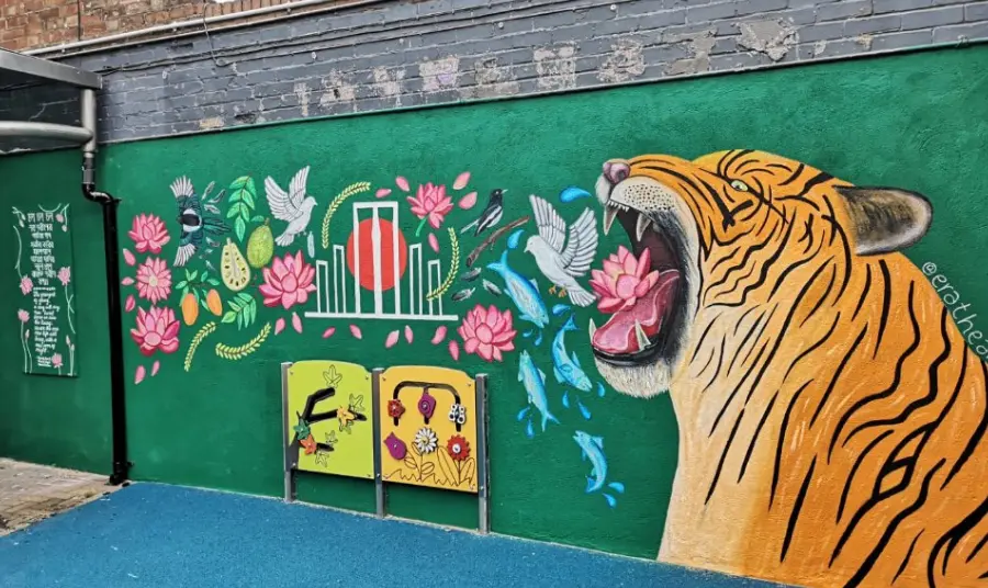 Photograph of a colourful wall mural featuring a tiger