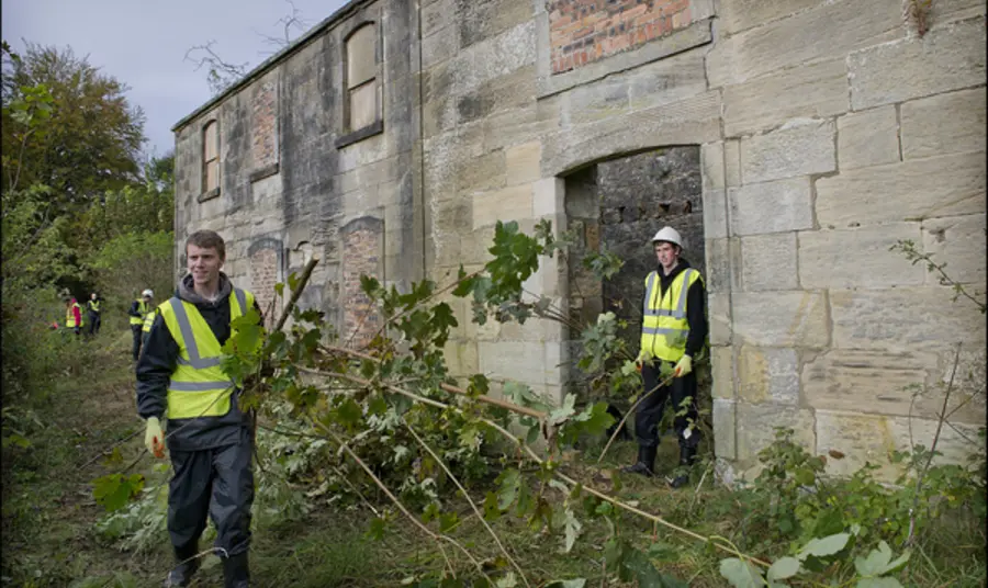 Two young men volunteering at Canal College