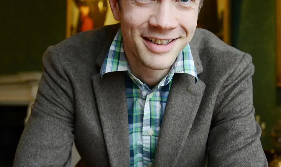 Chris Ferguson sits at a table