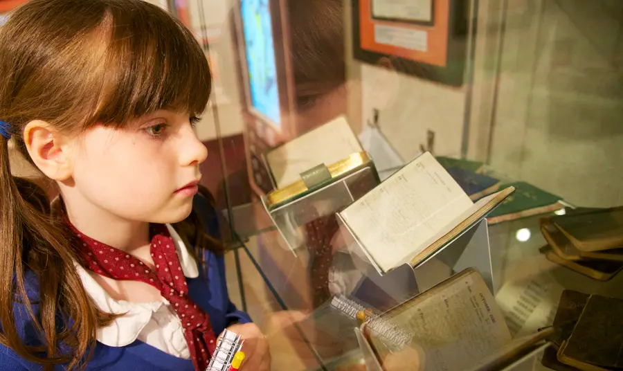 School pupil taking in some of the Seven Stories collections