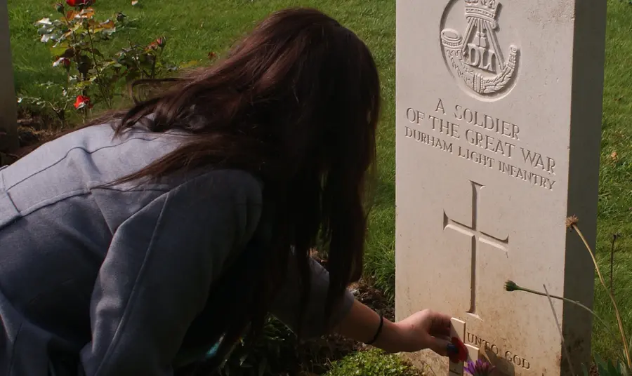 Lottery grants help North East youngsters explore First World War A student from King James I Academy lays a poppy on the grave of an unknown Durham solider