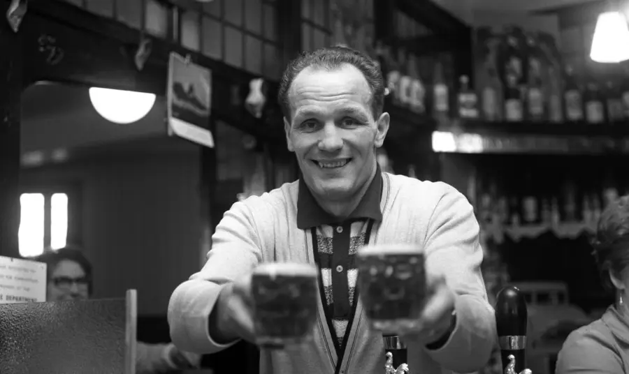 Henry Cooper behind the bar of The Fellowship Inn, South London in 1963