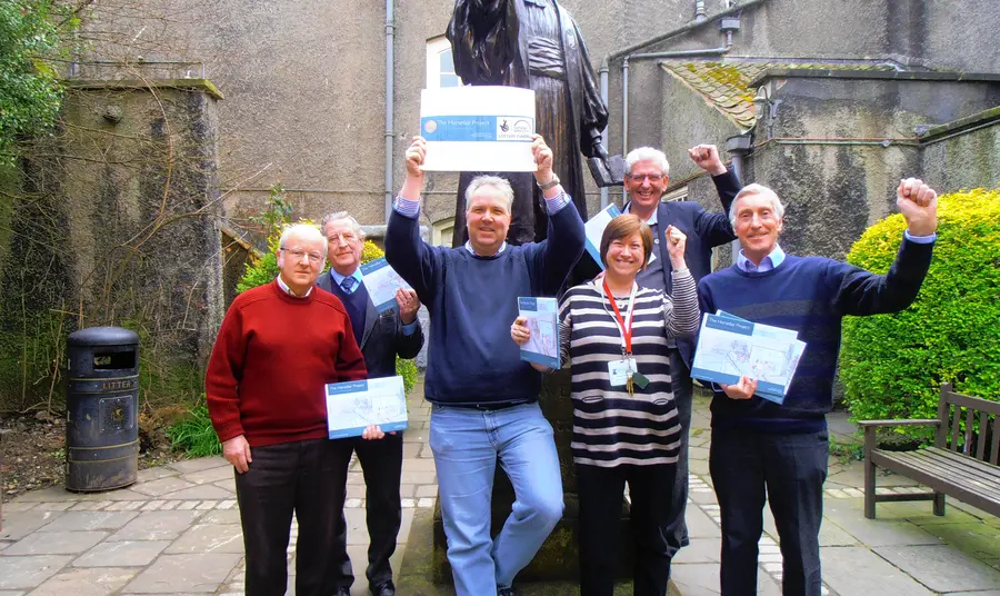 Staff and volunteers from the New Room celebrate the grant success