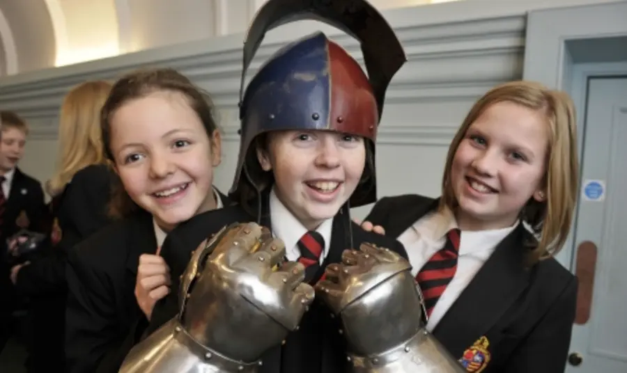 Children try on armour