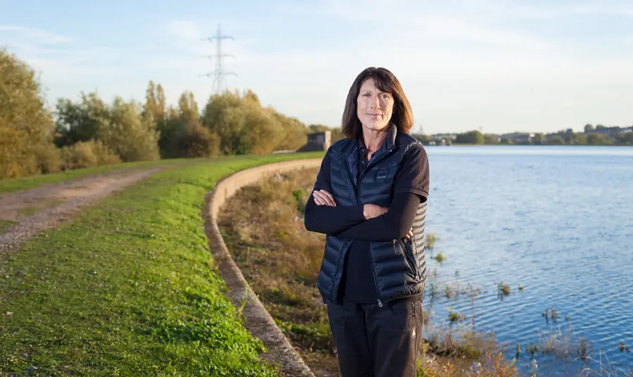Woman in front of lake
