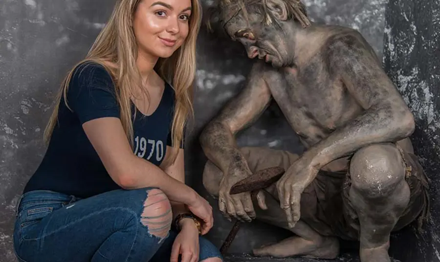 Jasmine with the statue of a miner at the Low Parks Museum, South Lanarkshire