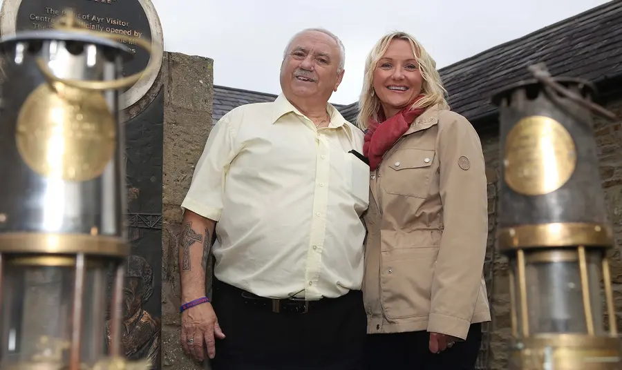Mining memories saved thanks to National Lottery surprise John Wiltshire being presented with a cheque by Vicky Peterson