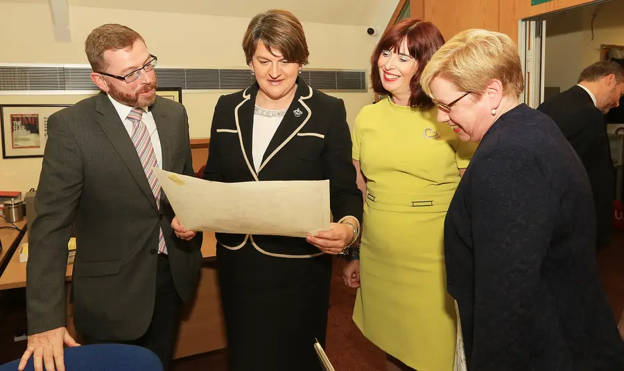 Digitising a divided society at Linenhall Library HLF NI Committee Member Mark Glover, First Minister Arlene Foster, Linenhall Library Director Julie Andrews at Linenhall Library