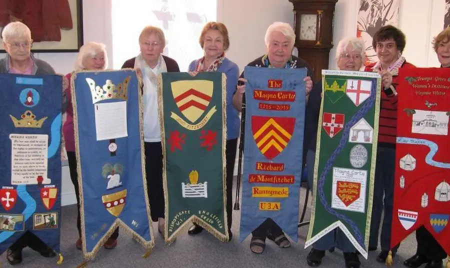 A group of project participants with banners