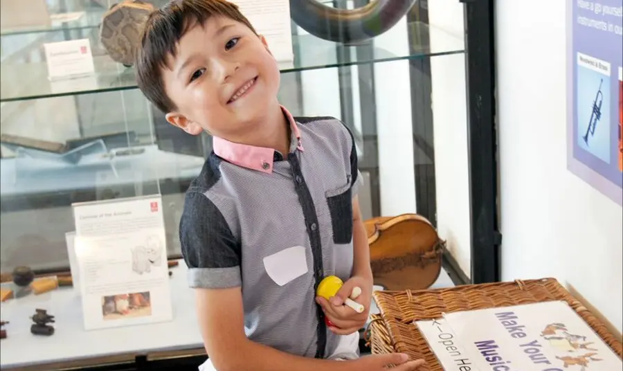 Child enjoying education activities of the Royal College of Music Museum 