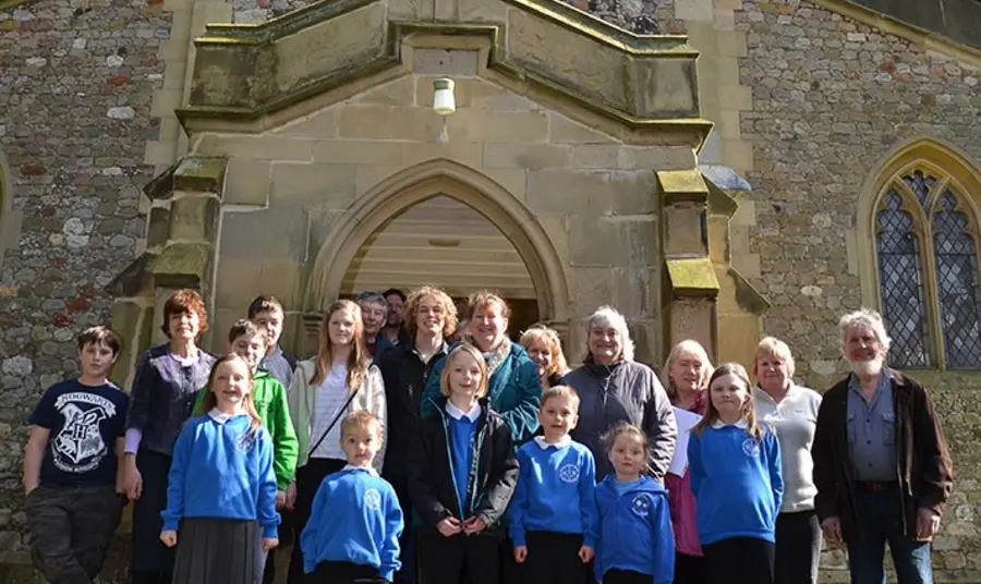 Local community of Roos celebrate their success outside All Saints Church, Roos
