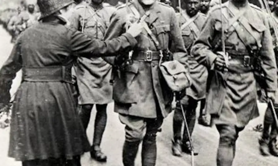 A lady pinning a flower onto a Sikh soldier in 1916 A lady pinning a flower onto a Sikh soldier in 1916