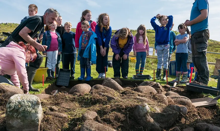 Communities in partnership with nature Staffin Primary School pupils during an archaeological dig