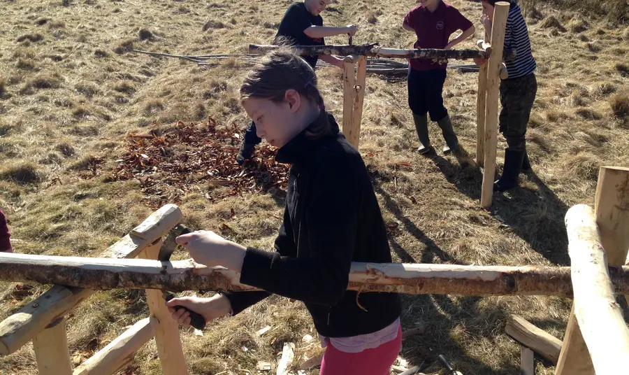 Young people making peat spade handles for the Talking Turf project