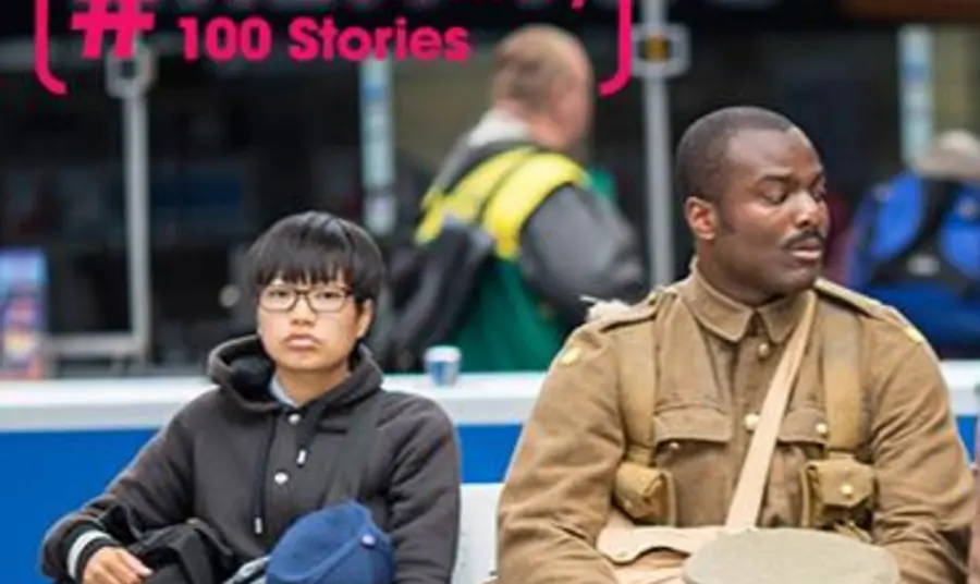One Centenary 100 Stories 21st century man dressed as First World War soldier sitting next to commuters in a train station