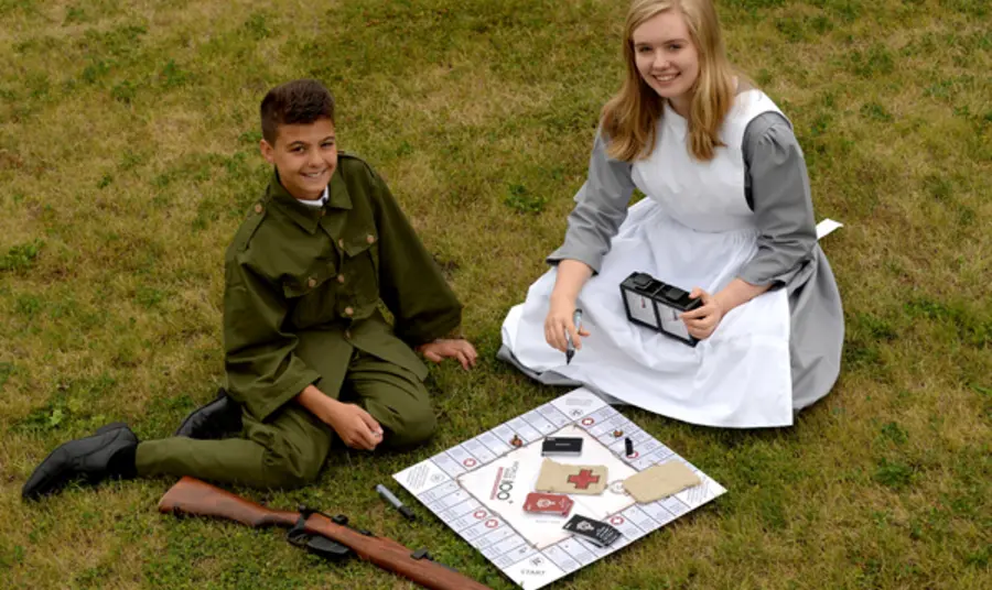 First World War board game launched Isaac Khan and Sophie Turbot in period costume with the First World War board game.